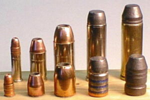 A group of different types of bullets on top of a table.